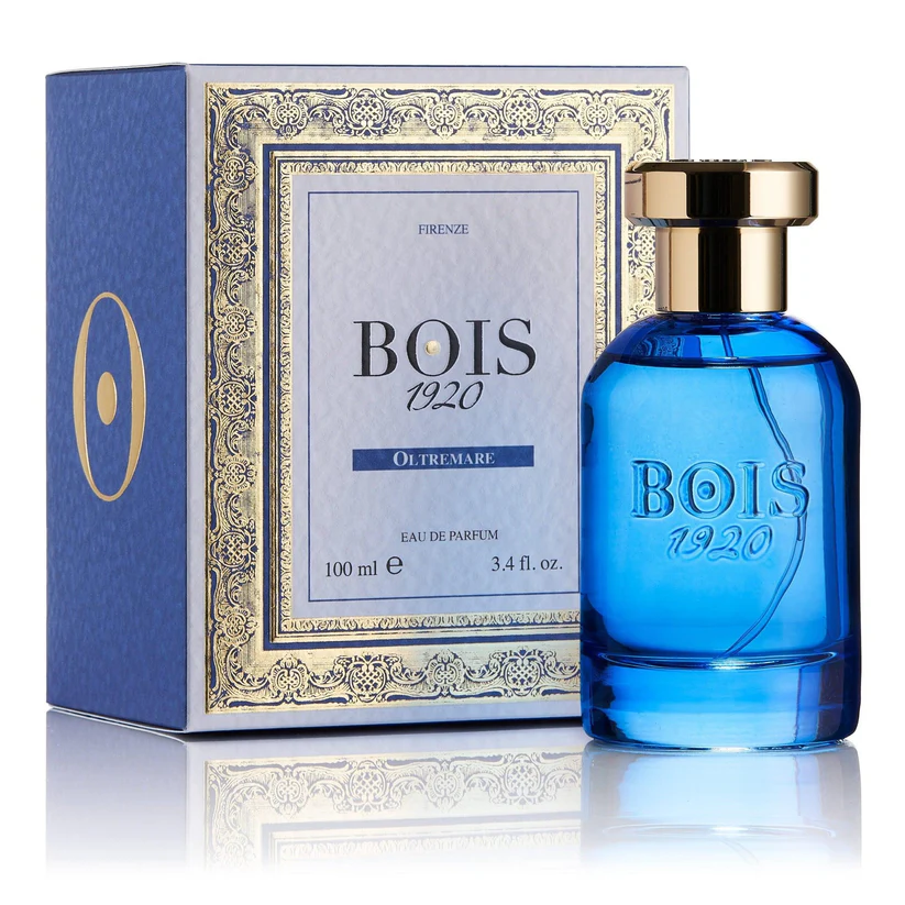 Flacone blu Bois 1920 Oltremare eau de parfum 100 ml dal tappo dorato accanto alla scatola azzurra con cornice oro